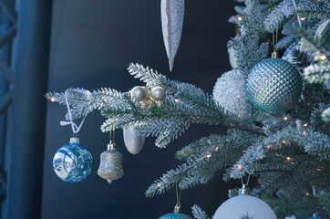 Christmas balls of on a blurred background, decorated with a silver branch.