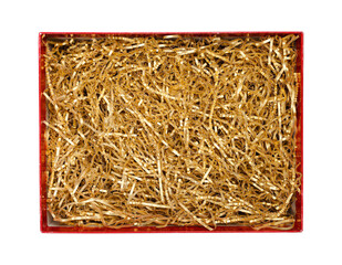 Golden shredded paper for gifting and stuffing in cardboard box. Top view, clipping path included