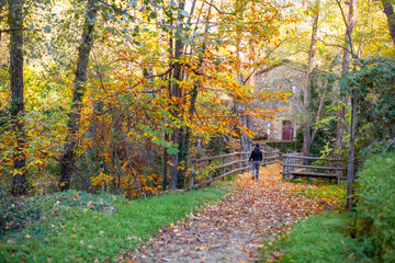 Fototapeta premium Visitor at old watermill of Banos de Montemayor, Spain
