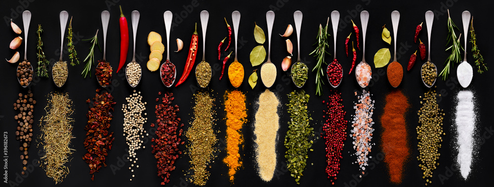 Wall mural Various spice and herbs on dark background