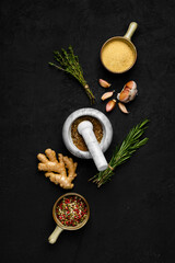 Composition with mixture of peppers, ginger, garlic, thyme and rosemary
