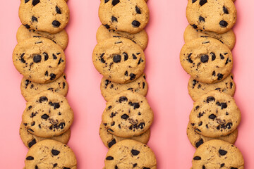 Cookies with chocolate on a pink background. Sweet background.