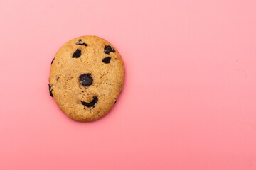 Smiley cookies on a pink background.