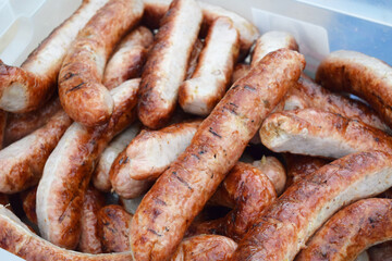 hot sausages on a grill