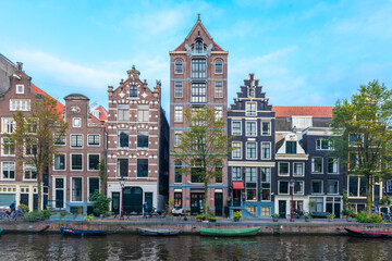 Naklejka premium Amsterdam City Center. Beautiful view of Amsterdam Canals with Bridge and typical Dutch Houses. Netherlands.