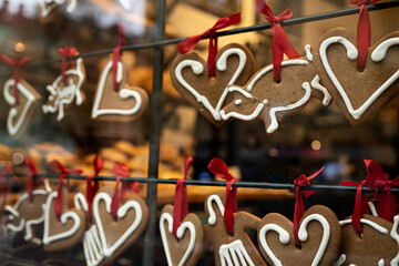 Retail shop window decorated with beautiful gingerbread, creating happy Christmas spirit.