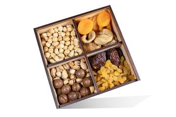 Set of dried fruits with nuts isolated on white. Close-up. Cashews, hazelnuts, peanuts, dried apricots, viburnum, raisins. healthy and wholesome food
