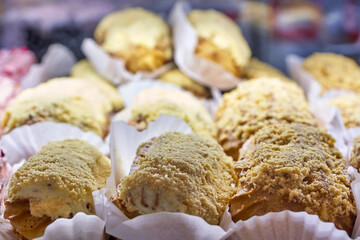 Eclair cakes on a bakery showcase, close up