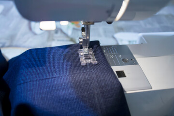 Image of a sewing machine with blue cloth on it