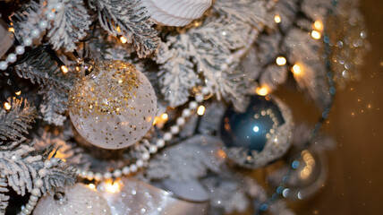 Christmas festive background, fir tree with bokeh lights and new year balls. Festive New Year background.