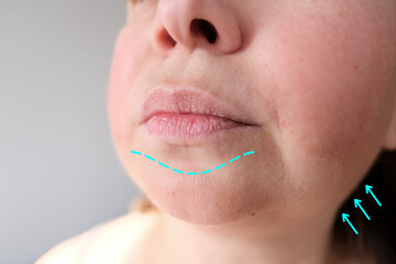 lips, mouth and chin of a middle-aged woman, part of the face close-up, fine wrinkles on the face,...