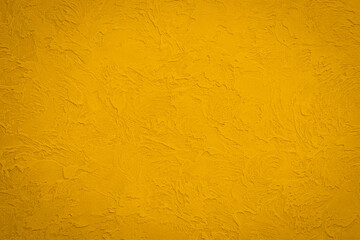 Luxurious backdrop of Venetian stucco in trendy color of 2021 Fortuna Gold. Handwork. Texture of...