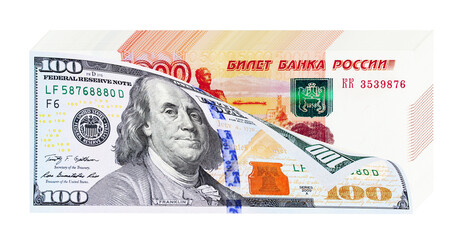 One hundred dollar bill and stack of russian five thousand banknotes as russian money devaluation concept
