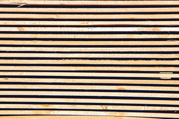 Fototapeta premium Edged boards in stock, ready for sale. construction materials.