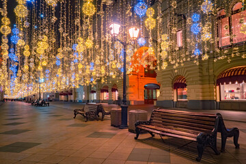 Fototapeta na wymiar Christmas in Moscow. The capital of Russia is decorated for the New year. Nikolskaya street in Moscow. The center of Moscow is decorated with garlands. New year illumination in the Russian capital.
