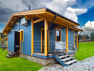 Country house made of wood. Cottage with air conditioning and video surveillance system. Vacation...