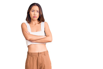 Young beautiful chinese girl wearing casual clothes skeptic and nervous, disapproving expression on...