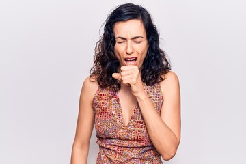Young beautiful hispanic woman wearing casual clothes feeling unwell and coughing as symptom for...