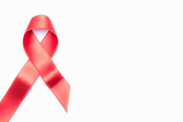 Hiv support. Red ribbon symbol in hiv world day isolated on white background. Awareness aids and cancer. Aging Health month concept.
