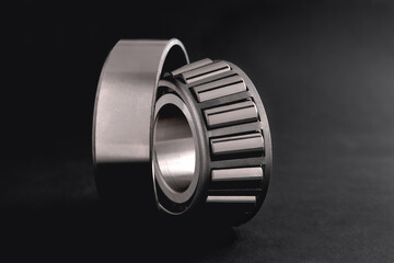 roller bearing on a black background close-up, blur as an artistic device