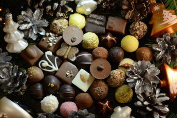 A set of assorted chocolates with New Year's toys. View from above
