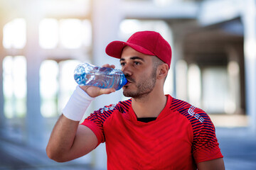 Athletic man with water bottle