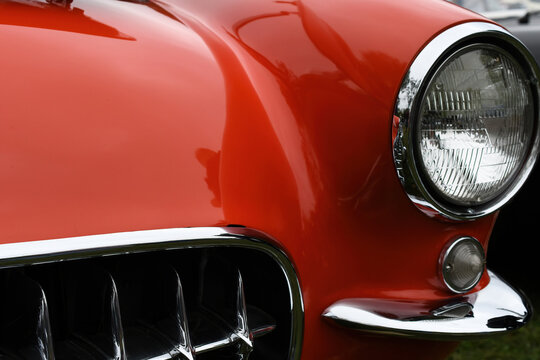 Front end and grill of classic red sports car
