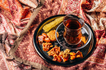 Tea in armudu with oriental delights and crystal sugar