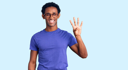 Fototapeta premium African handsome man wearing casual clothes and glasses showing and pointing up with fingers number four while smiling confident and happy.