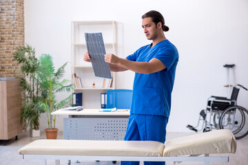 Young male doctor radiologist working in the clinic