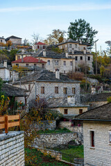 Fototapeta na wymiar Traditional stone building during fall season in the picturesque village of Aristi in Zagori Greece.