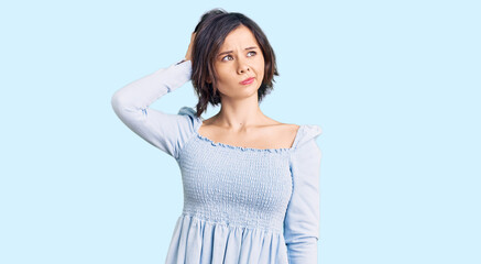 Young beautiful girl wearing casual clothes confuse and wondering about question. uncertain with...