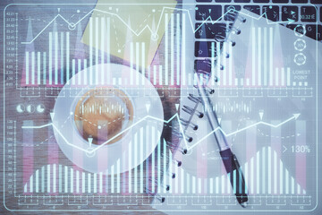 Double exposure of forex chart drawing over table background with computer. Concept of financial research and analysis. Top view.