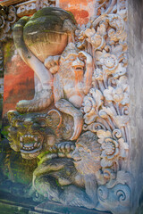 Ancient traditional Balinese bas-relief of monkeys