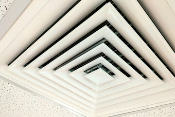Obraz premium Air Duct Ceiling white, Air duct in square shape, condition vent modern air conditioner or air vent on ceiling white, Duct for conditioning heating on a building ceiling.