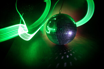 Colorful disco mirror ball lights night club background. Party lights disco ball. Selective focus
