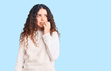 Beautiful kid girl with curly hair wearing casual clothes looking stressed and nervous with hands...
