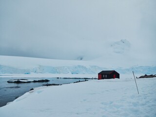 Cabin in Port Lockroi Antarctica beside Bay Surrounded by Snowy Glaciers