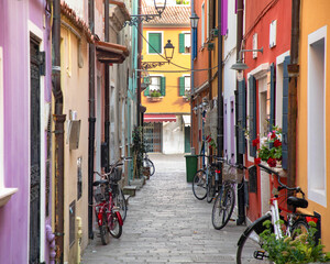 Alleys and streets among the colorful houses of the seaside village of Caorle