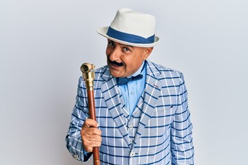 Mature middle east man with mustache wearing vintage and elegant fashion style skeptic and nervous, frowning upset because of problem. negative person.