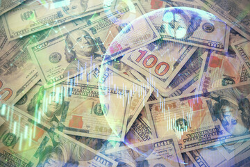 Multi exposure of forex chart drawing over us dollars bill background. Concept of financial success markets.