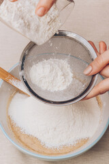 Dough preparation process, mixing of ingredients. Selective focus.