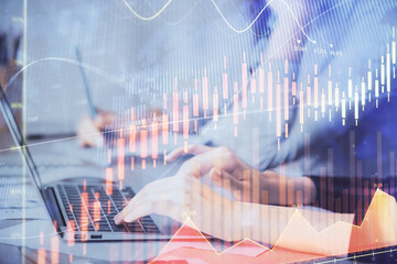 Multi exposure of woman hands typing on computer and financial chart hologram drawing. Stock market analysis concept.