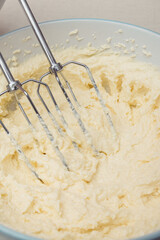 Process of kneading dough using a mixer. Close-up shot.