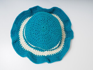 Blue with white strip crochet hat on an isolated background