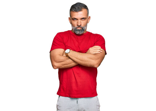 Middle age handsome man wearing casual clothes skeptic and nervous, disapproving expression on face with crossed arms. negative person.