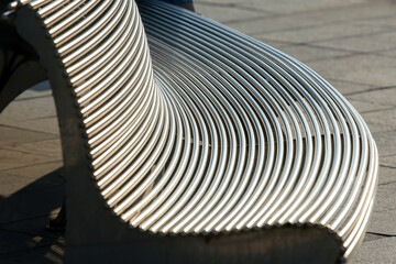 part of a metal outdoor bench. background abstraction