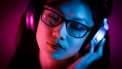 Young Asian woman dreams while listening to music - home shooting