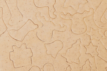 Gingerbread aromatic and spiced dough for Christmas cookie in different shapes prepared for baking,...
