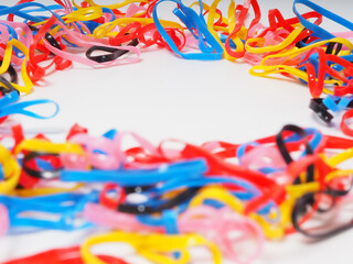 Macro shoot of multi color rubber bands on an isolated background